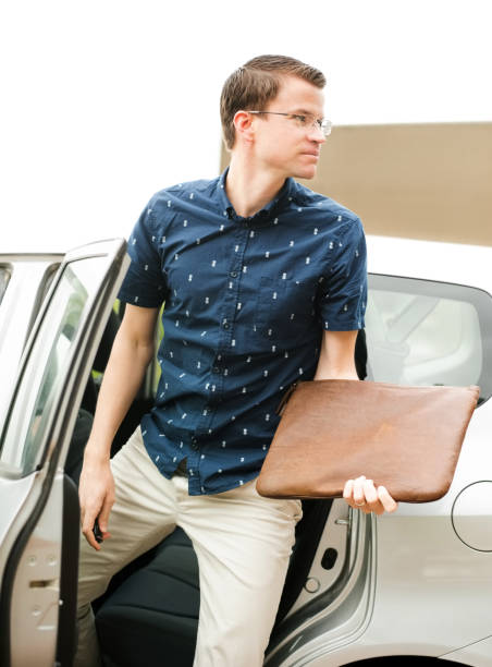 istock Getting out of a taxi 1128205608