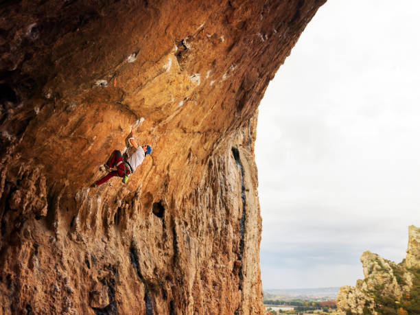 istock Young man sport climbing in overhanging position 1128206974