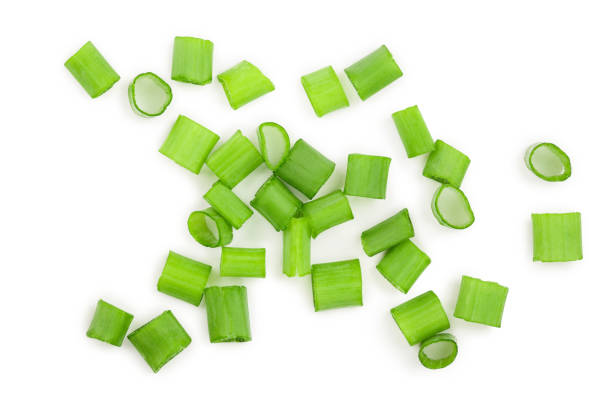 istock Chopped fresh green onions isolated on white background. Top view 1128209213