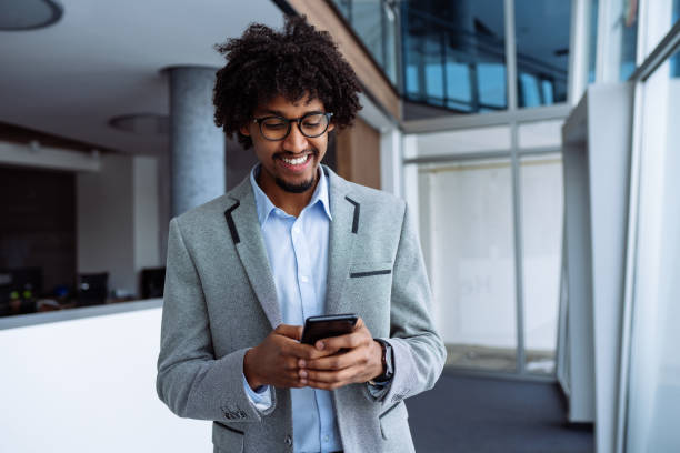 istock Young businessman typing on the smart phone 1128210778