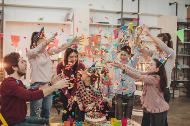 istock Teachers and kids throwing confetti on birthday 1128211899