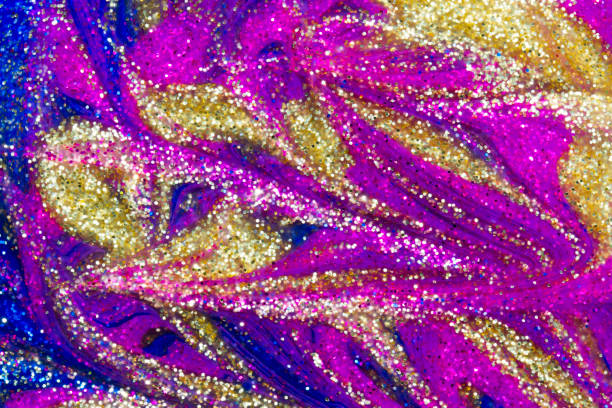 istock Metallic glitter paint swirls in silver, gold, blue and pink 1128211925