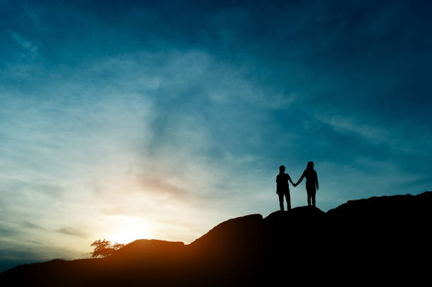 istock Silhouette of team leadership, teamwork and teamwork and delightful silhouette concepts 1128213798