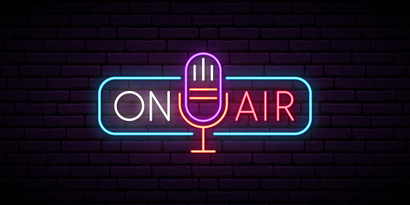 istock On air neon sign. Retro microphone in frame with inscription On Air. Music or radio emblem. Glowing signboard for radio station. Vector illustration. 1128214162