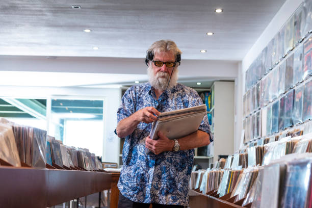 istock Record store owner in  his shop 1128217112