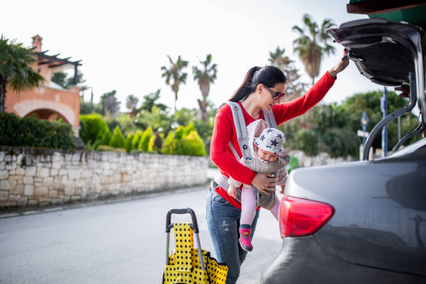 istock Taking out groceries from the car 1128217688