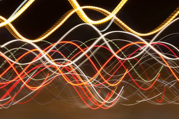 istock Abstract blurred colorful light effect on a black background. Long exposure photo of moving camera 1128219552