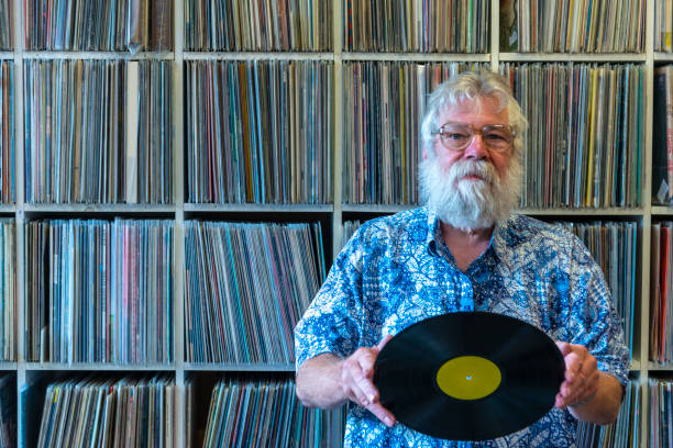 istock Record collector in front of his collection 1128219577