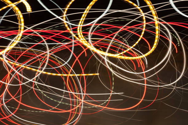 istock Abstract blurred colorful light effect on a black background. Long exposure photo of moving camera 1128219616