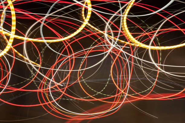 istock Abstract blurred colorful light effect on a black background. Long exposure photo of moving camera 1128219655
