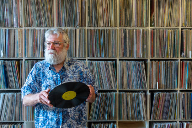 istock Record collector in front of his collection 1128221611