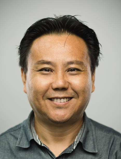 istock Real chinese mature man with happy expression looking at camera 1128221667