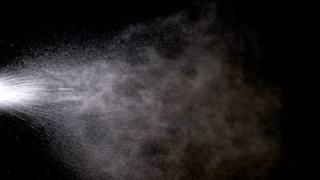 Water Spray against Black Background. Slow Motion