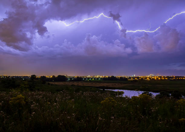 istock Intracloud lightning thunderbolt IC strikes at night above a city. 1128226692