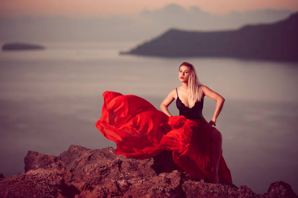 istock sexy woman in sunset time 1128228194