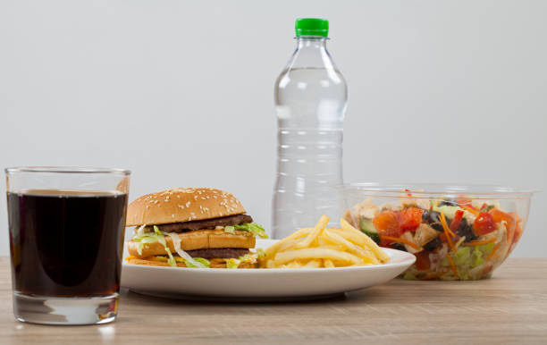 istock Fast food or fresh healthy food? 1128228270