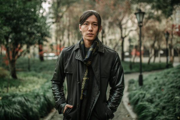 istock Asian man walking in the park 1128229443