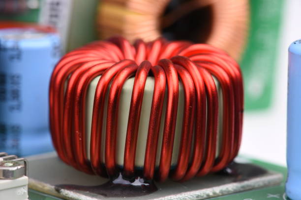 istock Copper Coil Inductor on Electronic Circuit Board 1128230898