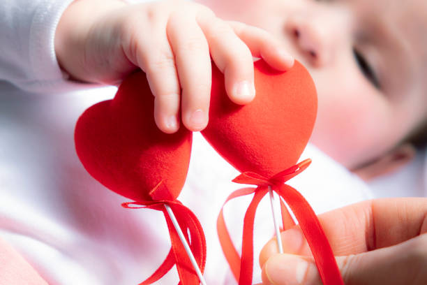 istock Baby with small hearts 1128232293
