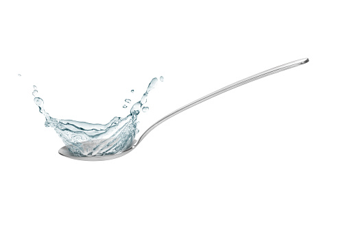 metall spoon with water splash isolated on white