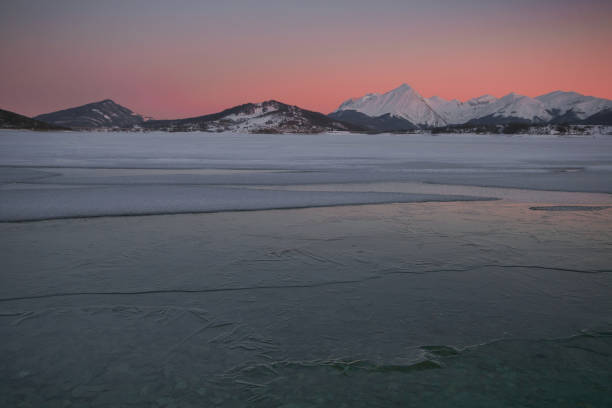 istock Wonderful sunset over Campotosto dam with snow in Abruzzo 1128233583