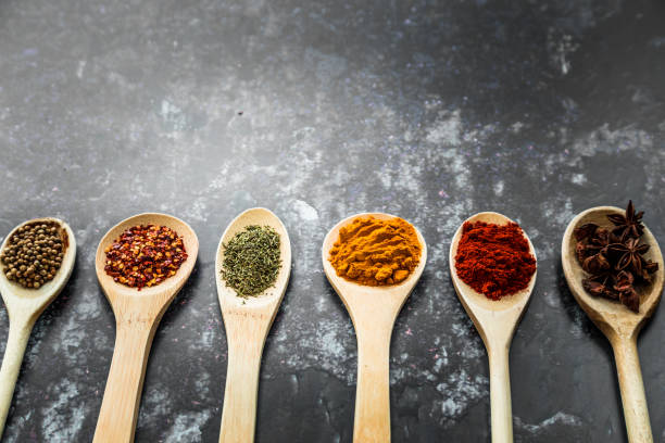 istock Selection of Colorful Fresh Herbs and Spices on Rustic Background 1128238226