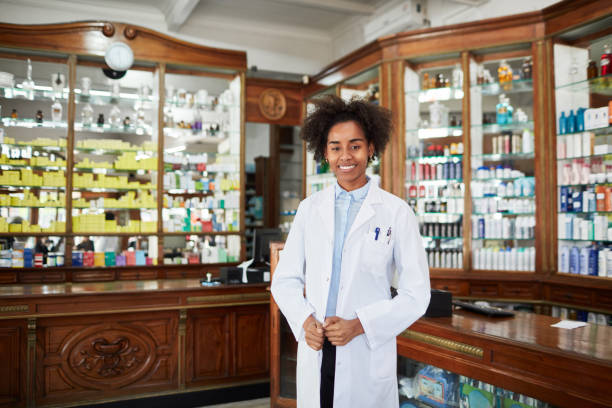 istock Confident female chemist at drugstore 1128239089