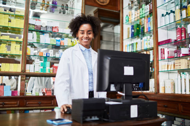 istock Female chemist working at pharmacy store 1128239150