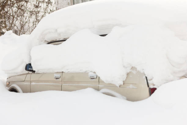 istock the car was snowed in in a Blizzard 1128239751