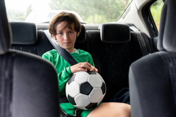 istock Boy in a car riding home after soccer practice 1128240862