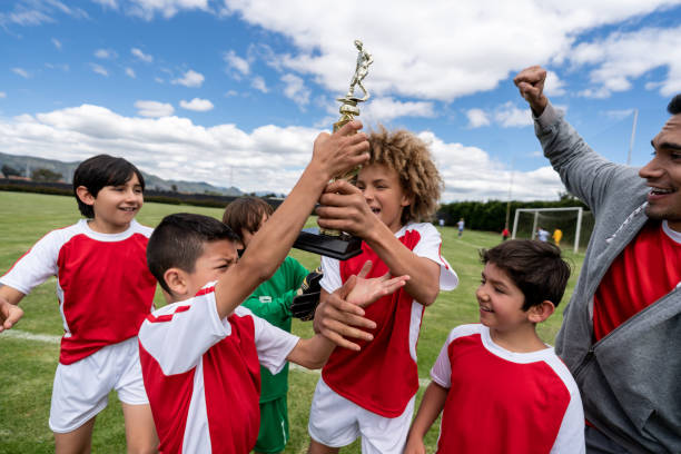 istock Group of kids winning a trophy playing soccer 1128240867