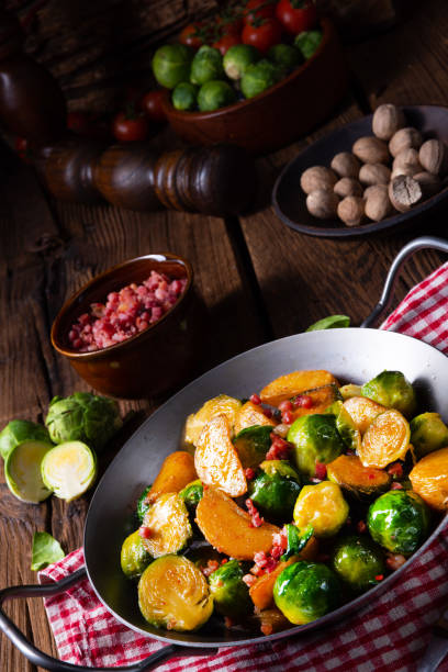 istock Brussels sprouts potato pan with bacon in rustic style 1128243702
