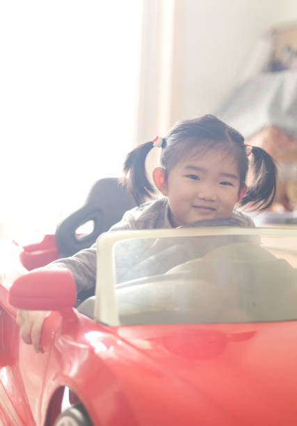 istock Little girl and toy car 1128247491