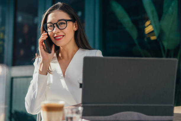 Happy businesswoman is having a call