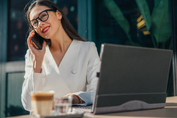 istock Pretty woman is using mobile phone 1128247741