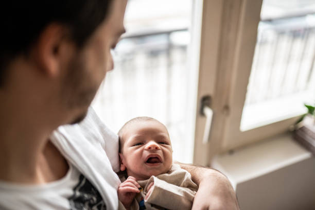 istock Newborn baby and father 1128249016