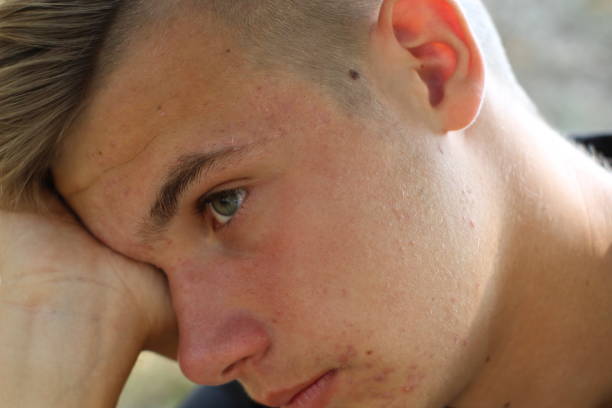 istock Portrait of sad boy 1128249354