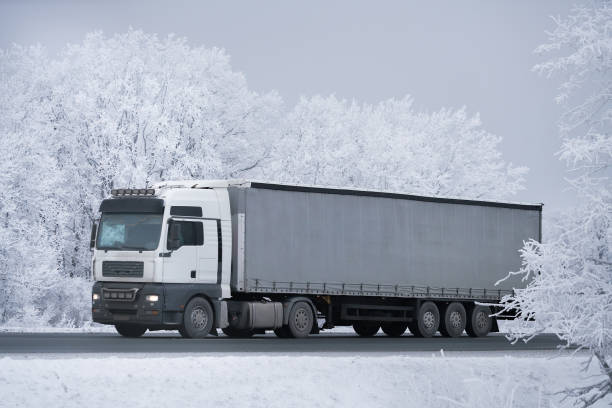 istock winter road transportation truck. 1128253701
