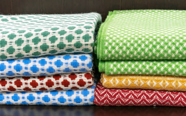 istock Woolen plaids on the shelf in the store. 1128255385