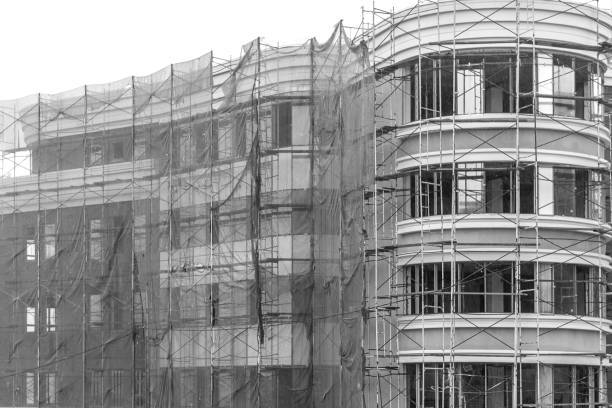 istock modern building under construction toning in black and white 1128255842