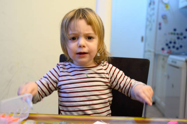istock Little girl drawing at home 1128256815