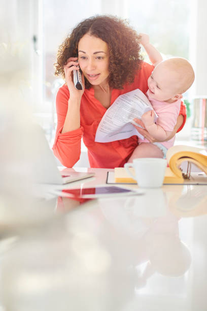 istock busy working mother and child 1128258520