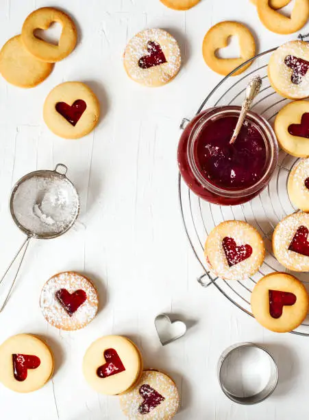Traditional Linzer cookie with strawberry jam, top view, copy space. Valentine's day concept