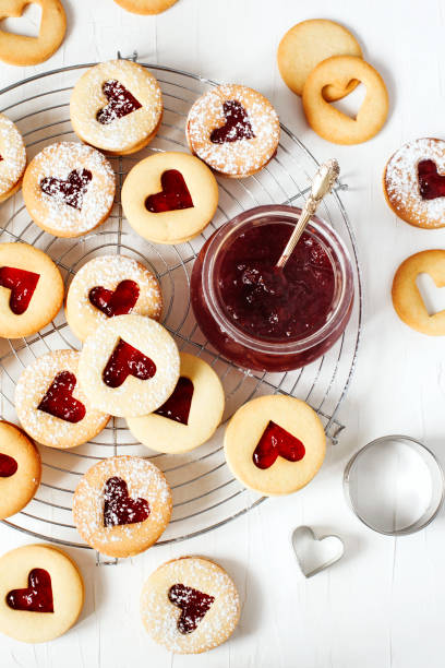 Traditional Linzer cookie with strawberry jam Traditional Linzer cookie with strawberry jam, top view white sugar cookie stock pictures, royalty-free photos & images