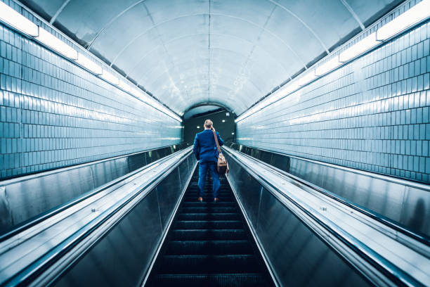business commuter on an escalator