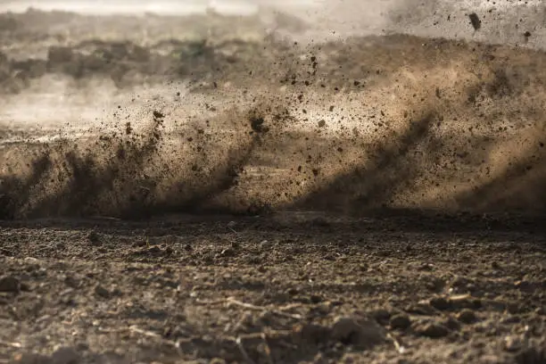 Photo of dirt fly after motocross roaring by