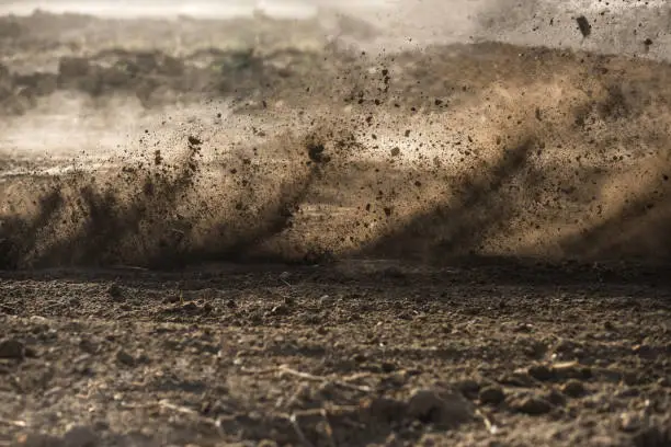 dirt fly after motocross roaring by