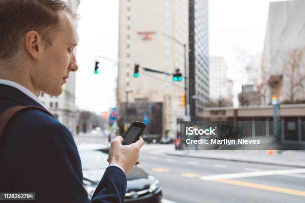 Man Using A Smart Phone Out In The City Stock Photo - Download Image Now - USA, 20-29 Years, Adult