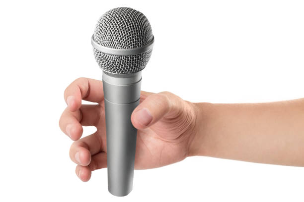 istock Hand with microphone on white 1128264987