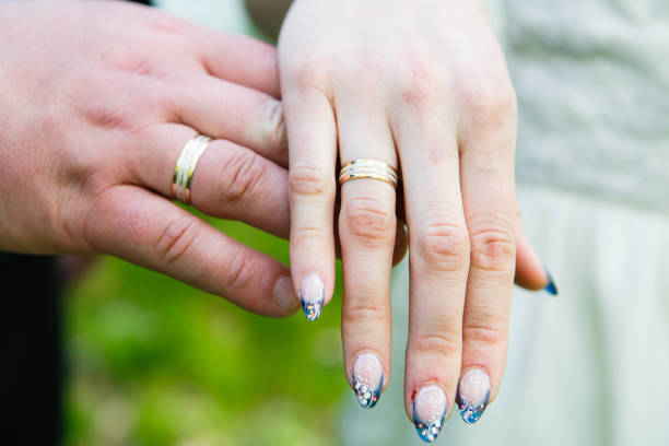 Couple upclose holding hands